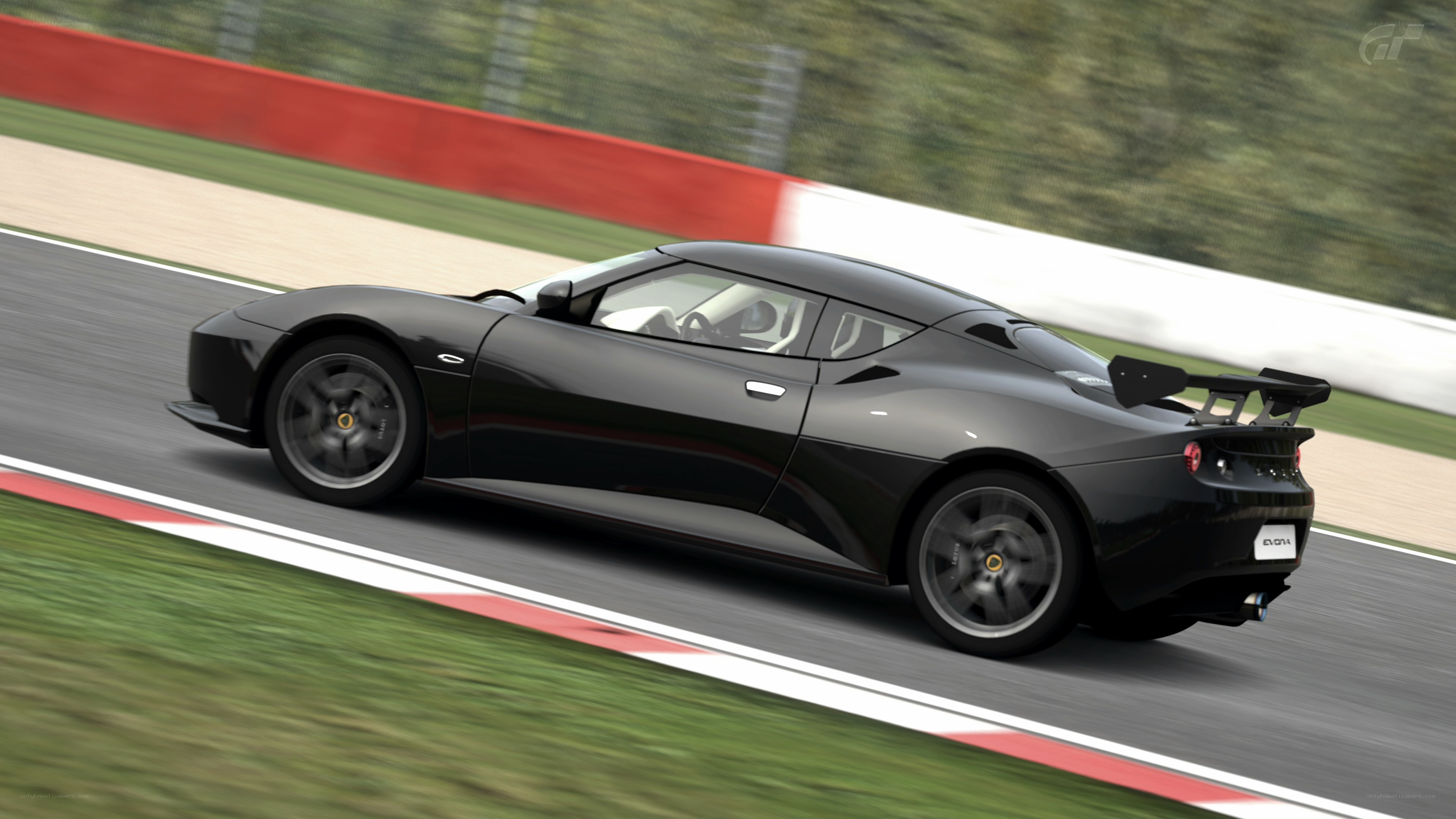 black lotus evora on racetrack