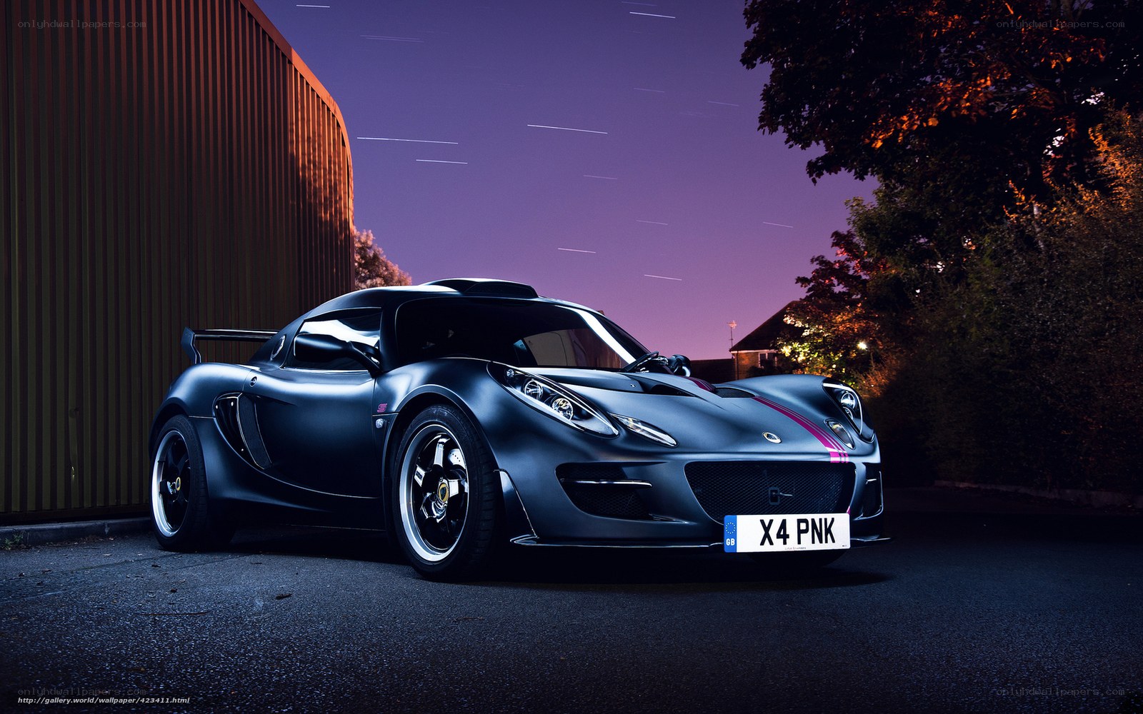 Black Lotus sports car at night