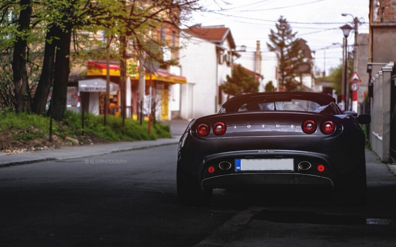 Black Lotus sports car on street
