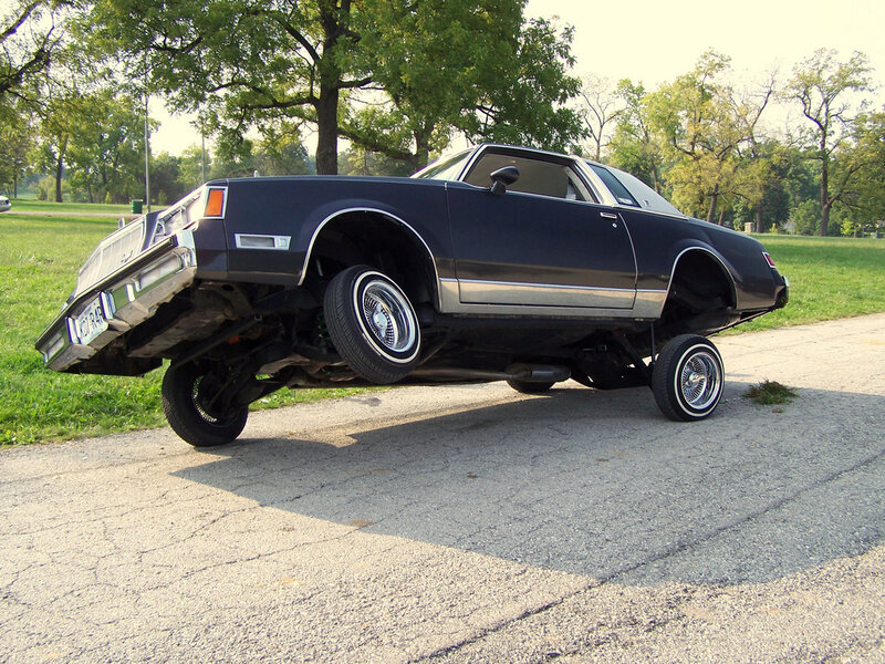 black lowrider car on street
