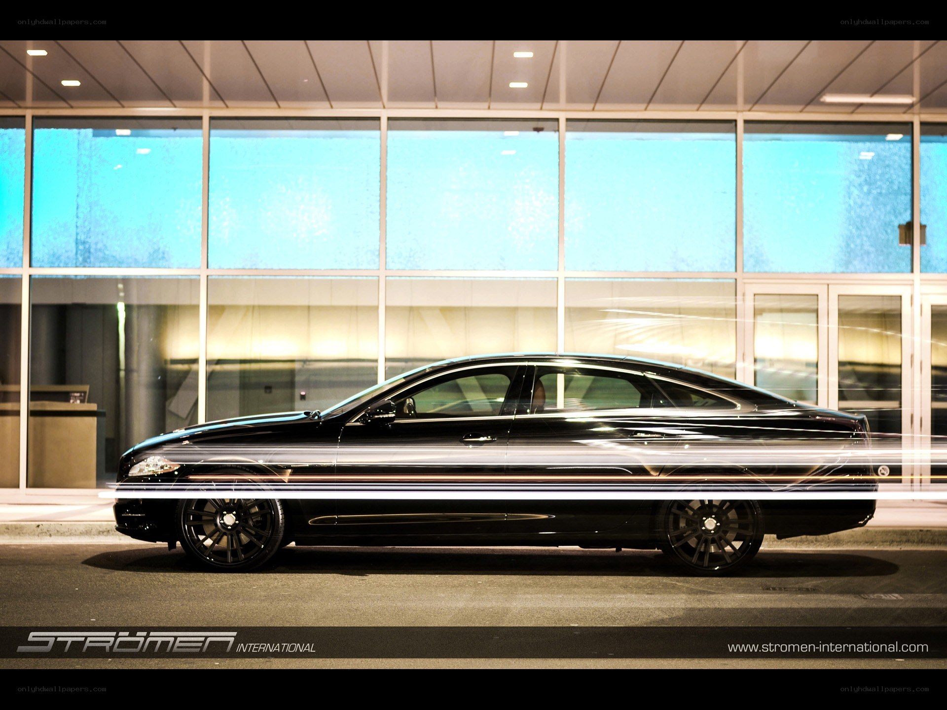 Black luxury car at night