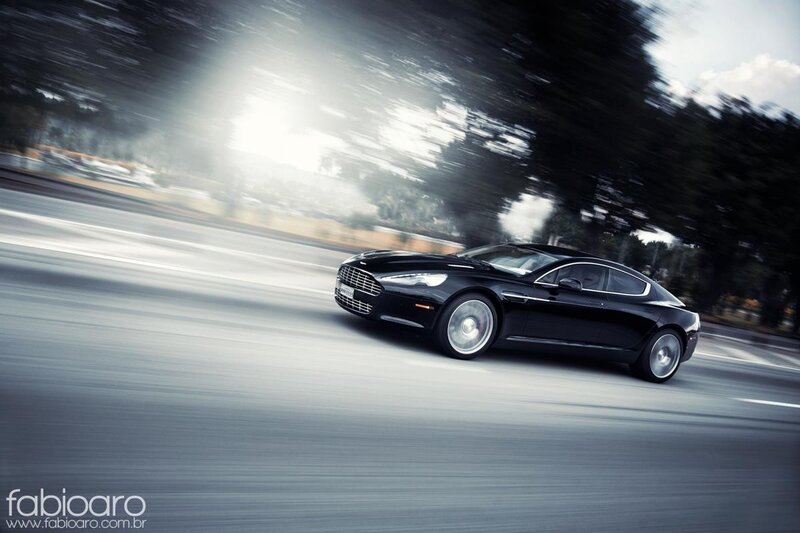 Black luxury car in motion