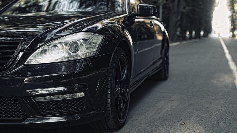 black luxury car on a road