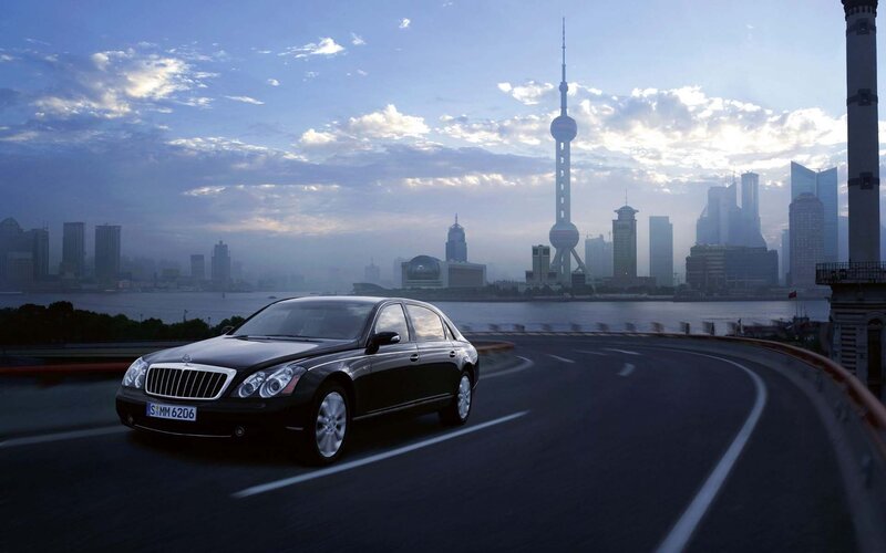 Black luxury car on city road