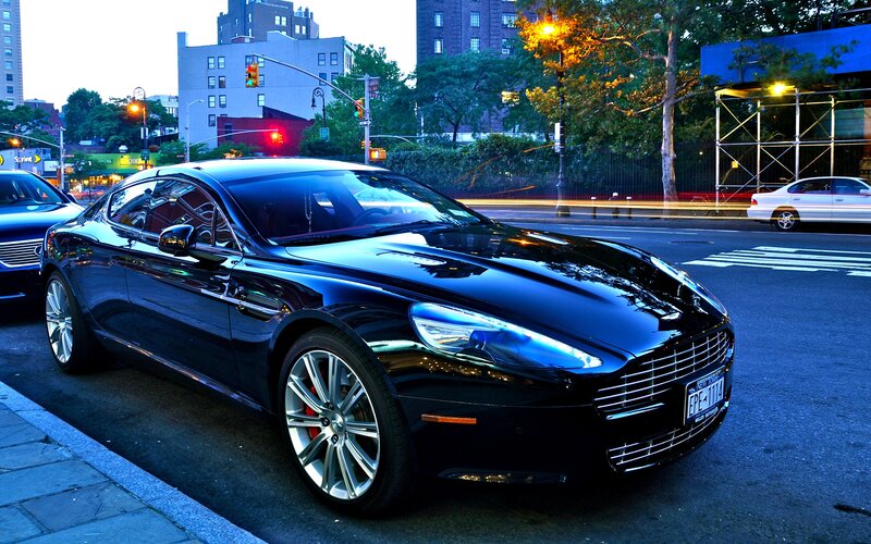 Black luxury car on city street