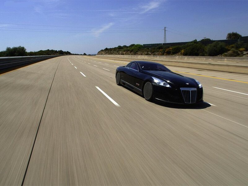 Black luxury car on highway