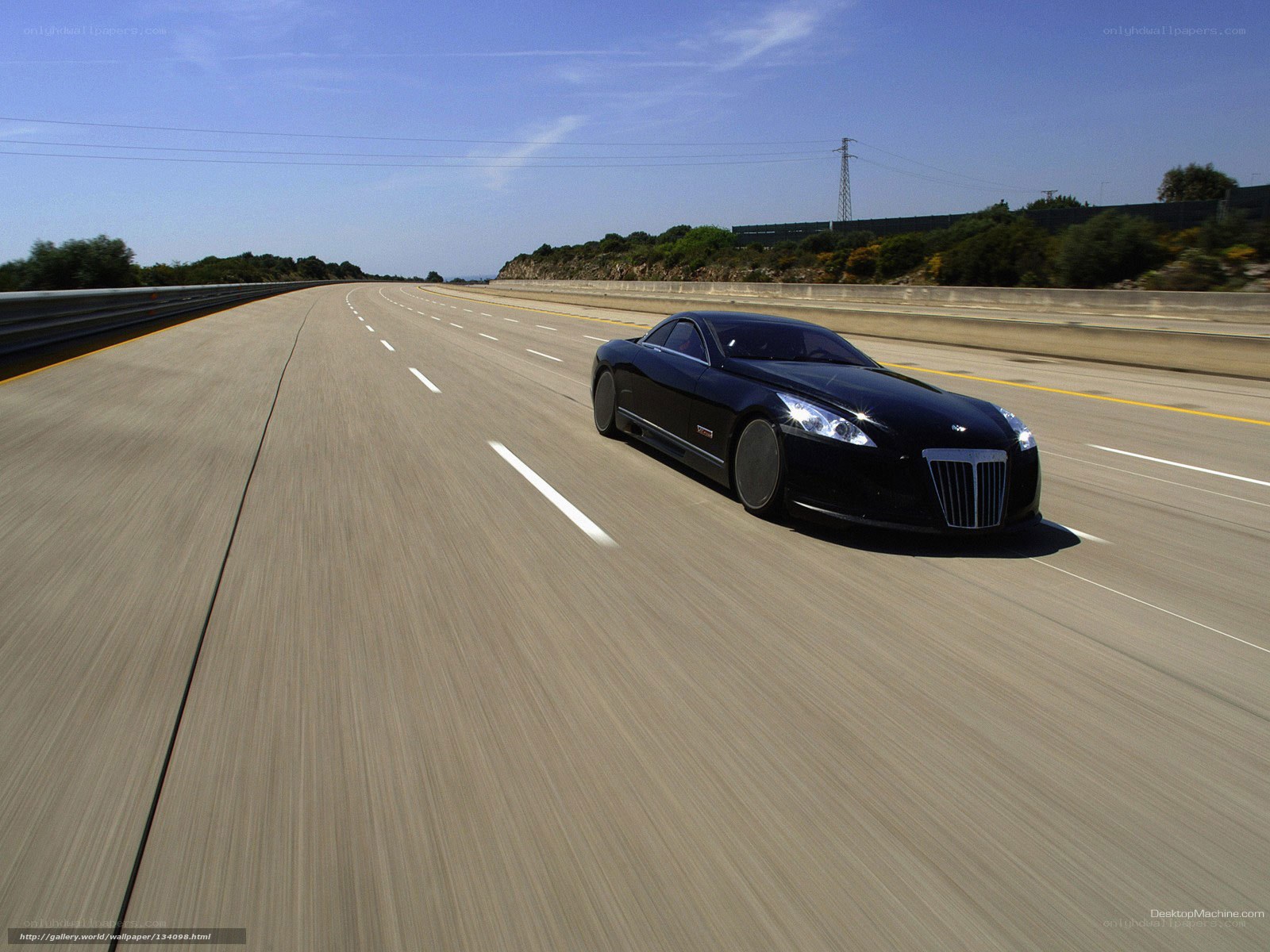 Black luxury car on highway