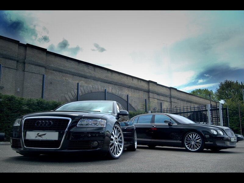 Black luxury cars parked