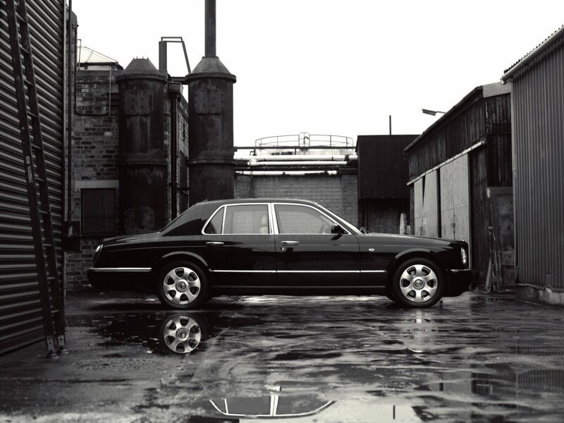 Black Luxury Sedan — Dramatic, Photograph, Industrial Buildings
