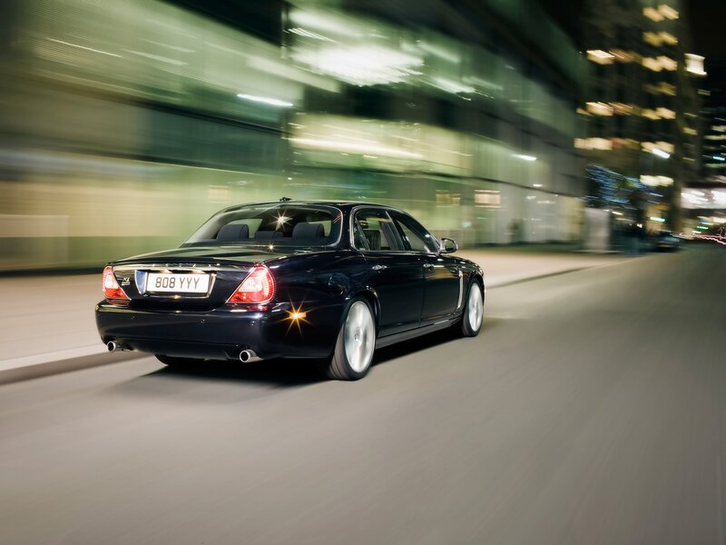 Black Luxury Sedan — Dynamic, Night, Photograph
