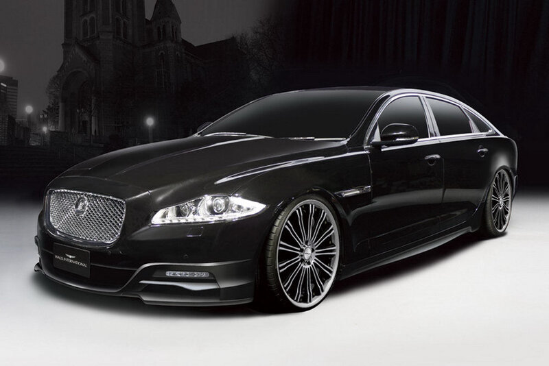 Black luxury sedan in city