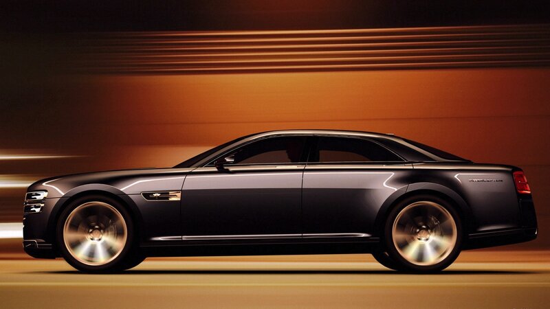 Black luxury sedan in motion