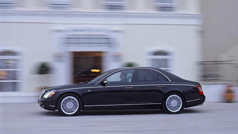 black luxury sedan in motion