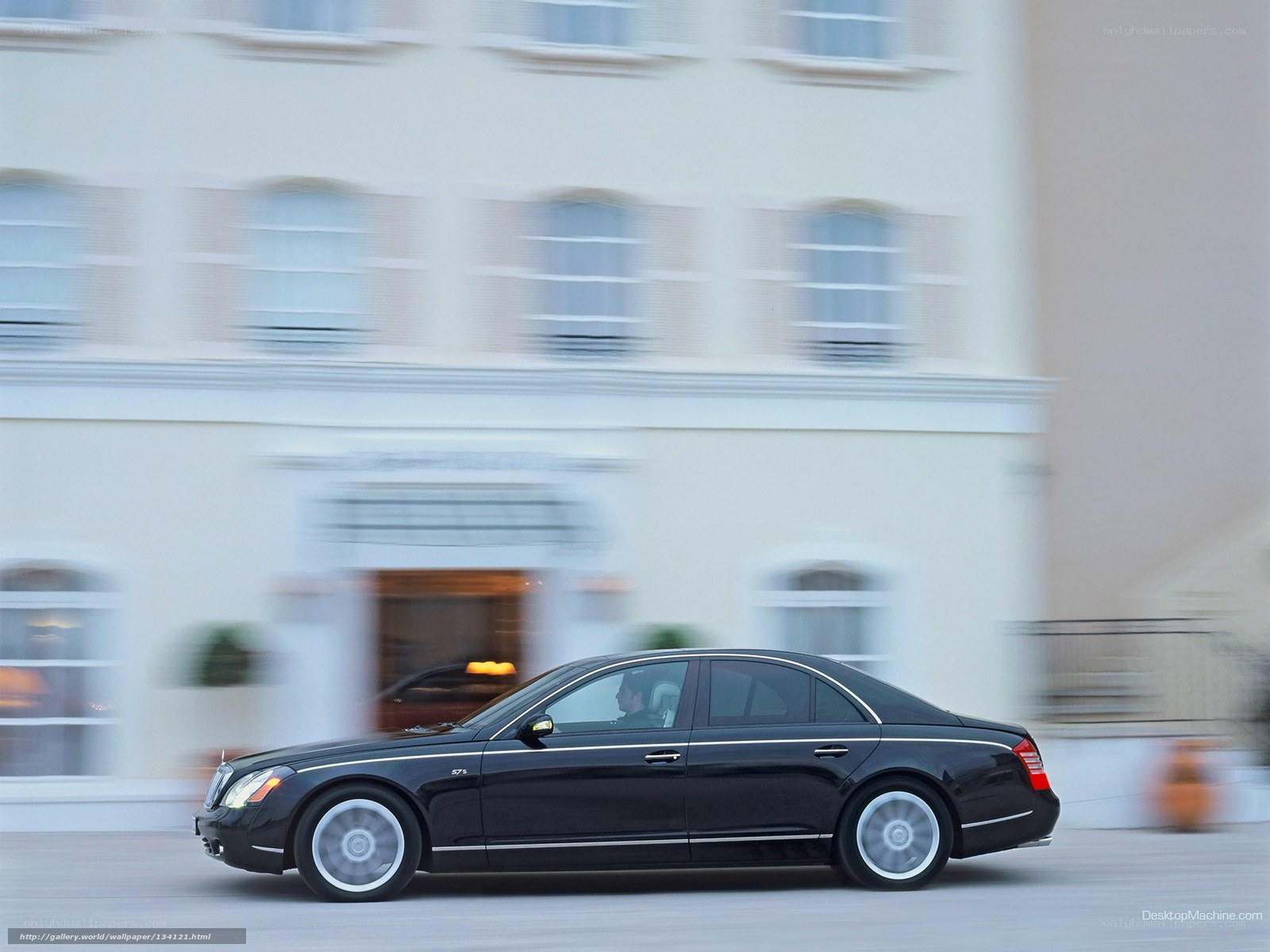 Black luxury sedan in motion