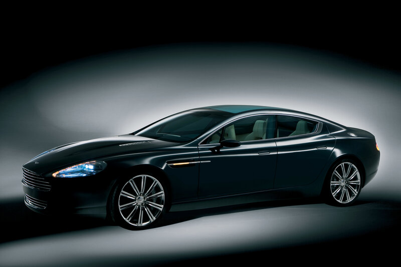 Black luxury sedan in studio