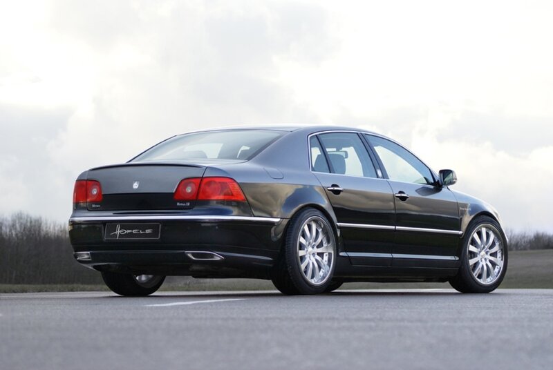 black luxury sedan on road