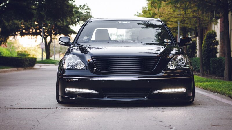 black luxury sedan on street