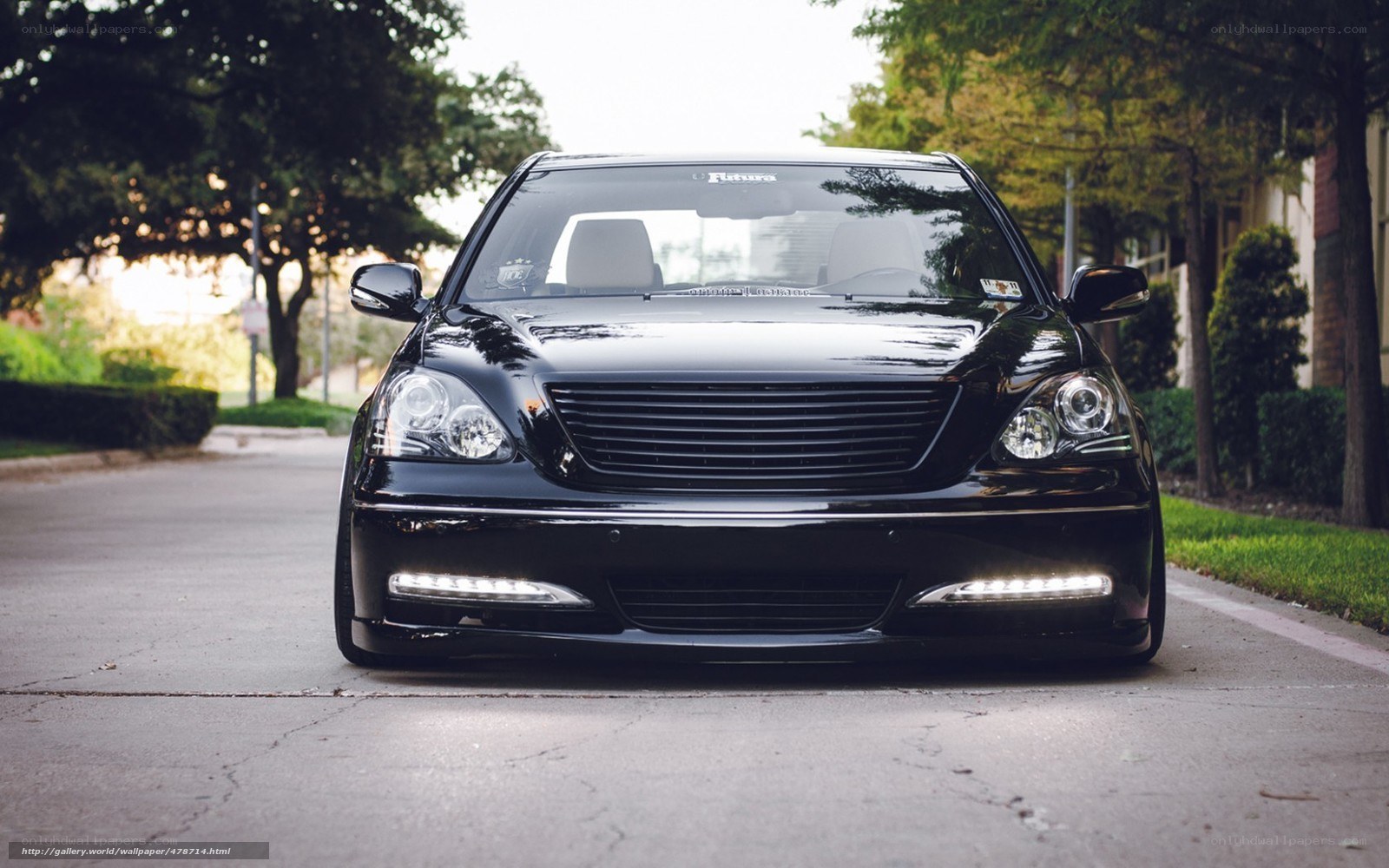 black luxury sedan on street