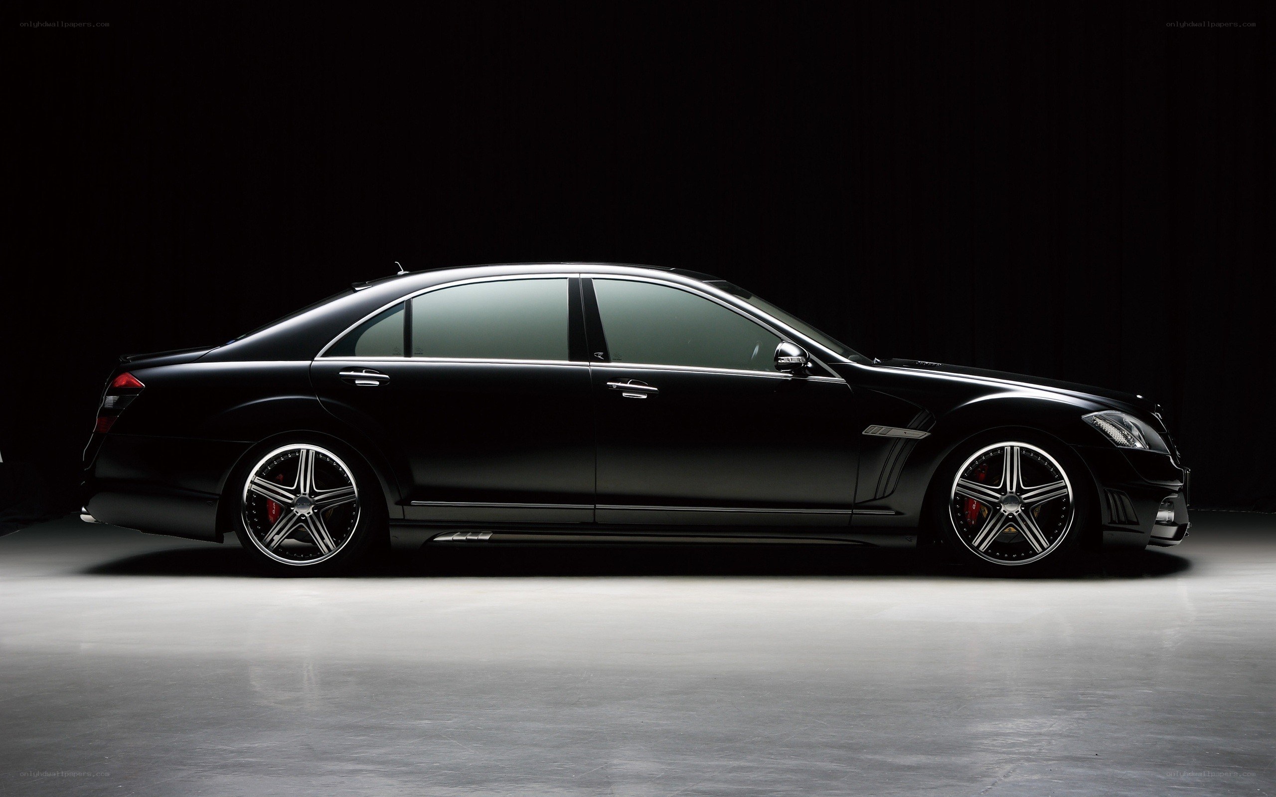 black luxury sedan side profile