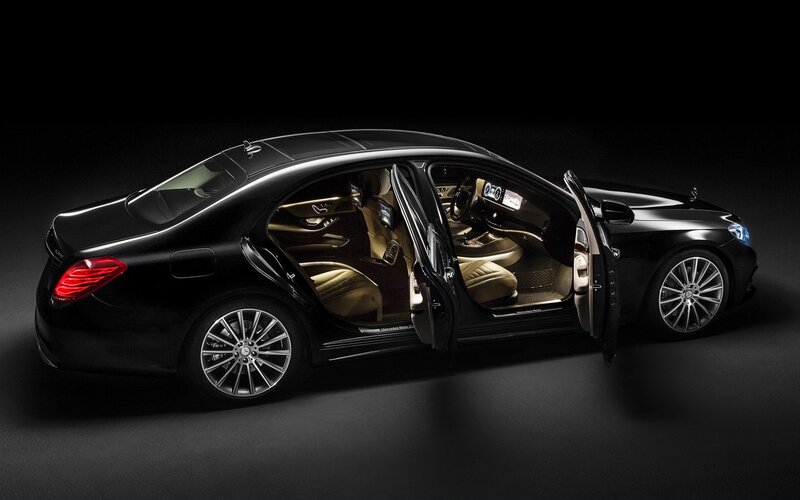 Black luxury sedan with open doors