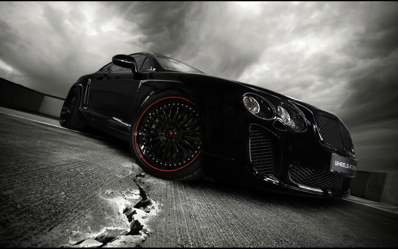 Black luxury sports car on track