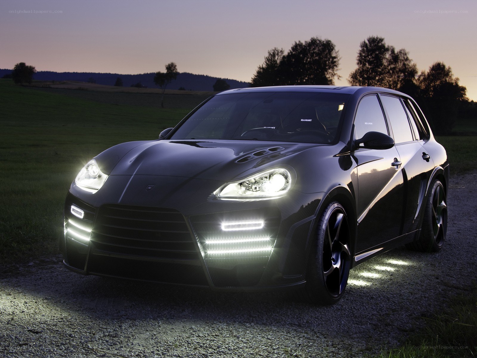Black luxury SUV at dusk