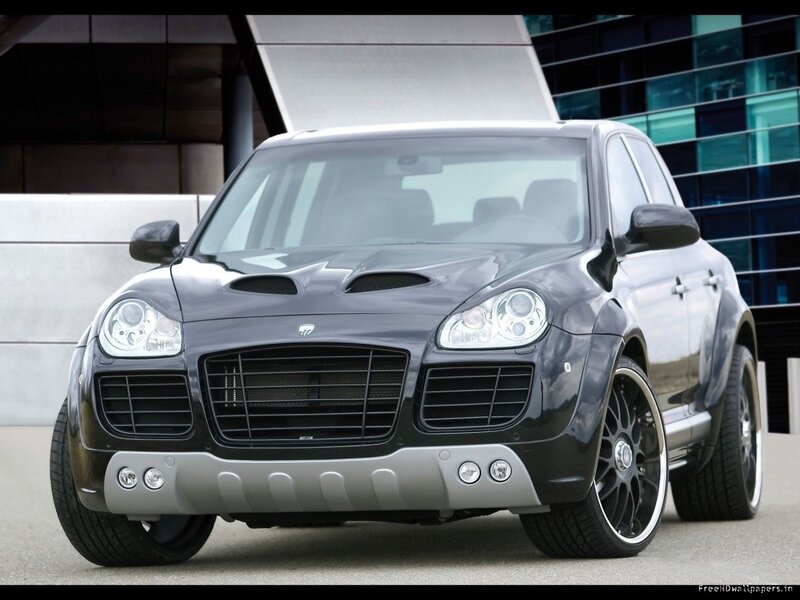 black luxury SUV in front of building