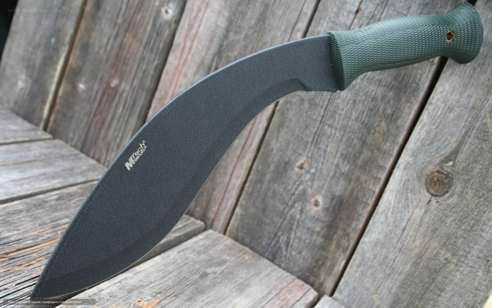 black machete on wood