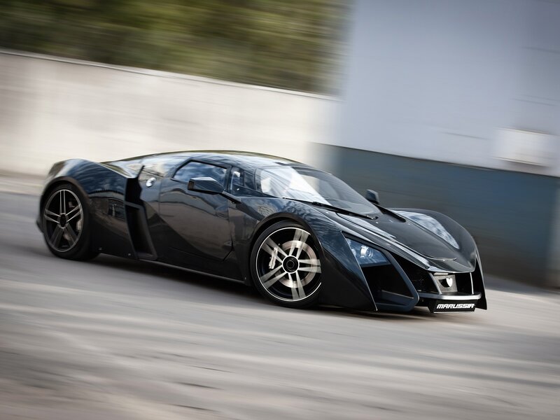 Black Marussia sports car in motion