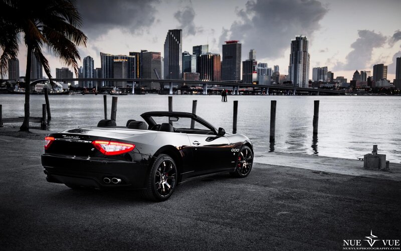Black Maserati convertible by waterfront