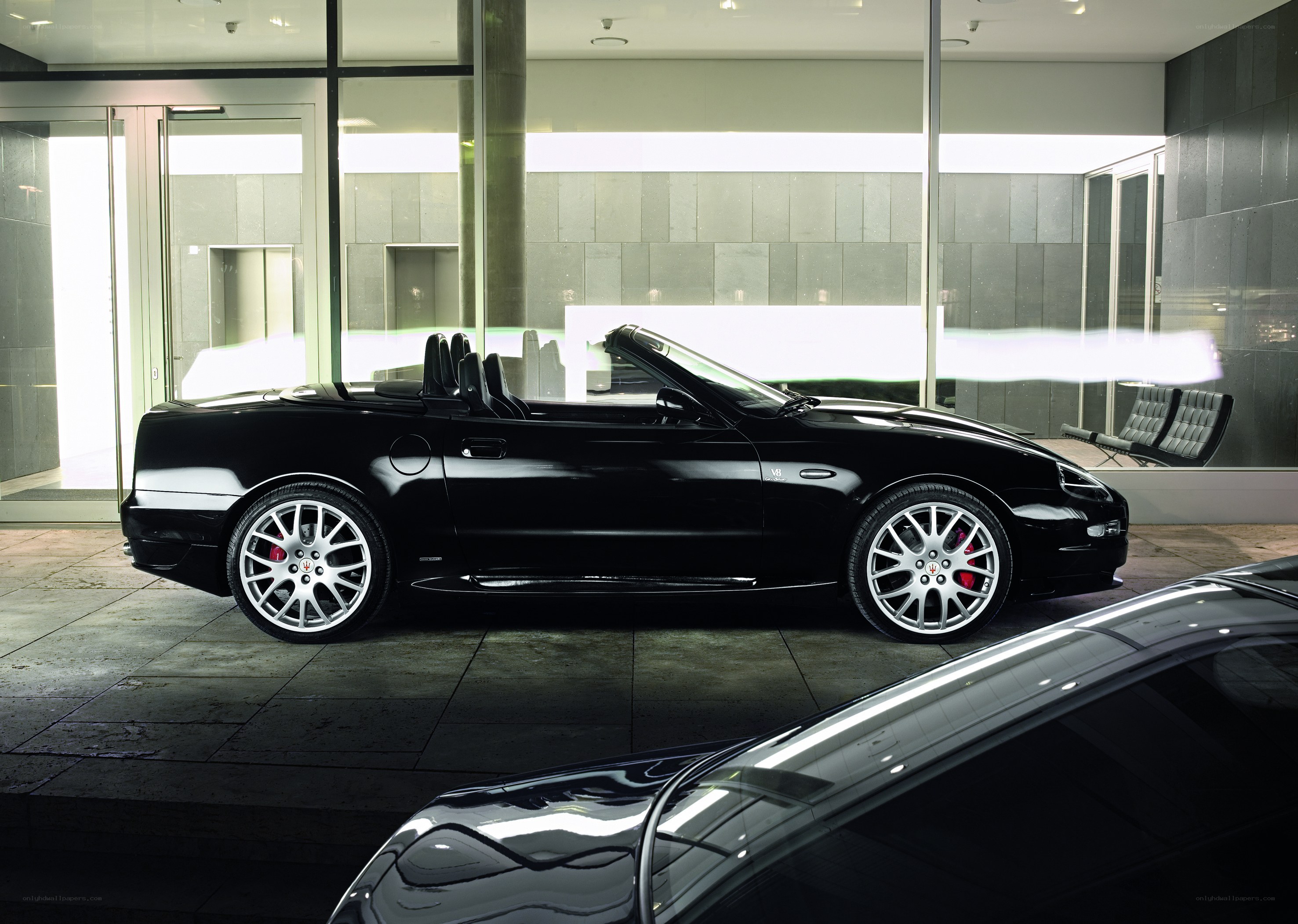 Black Maserati convertible in showroom
