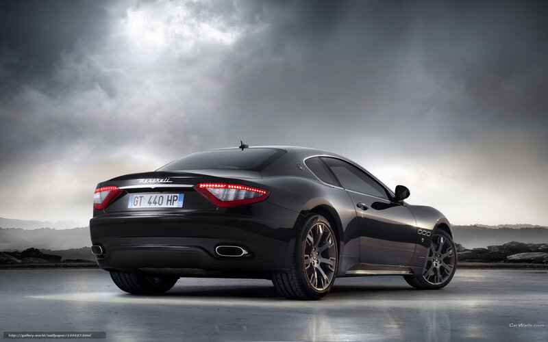 Black Maserati GT in dramatic lighting