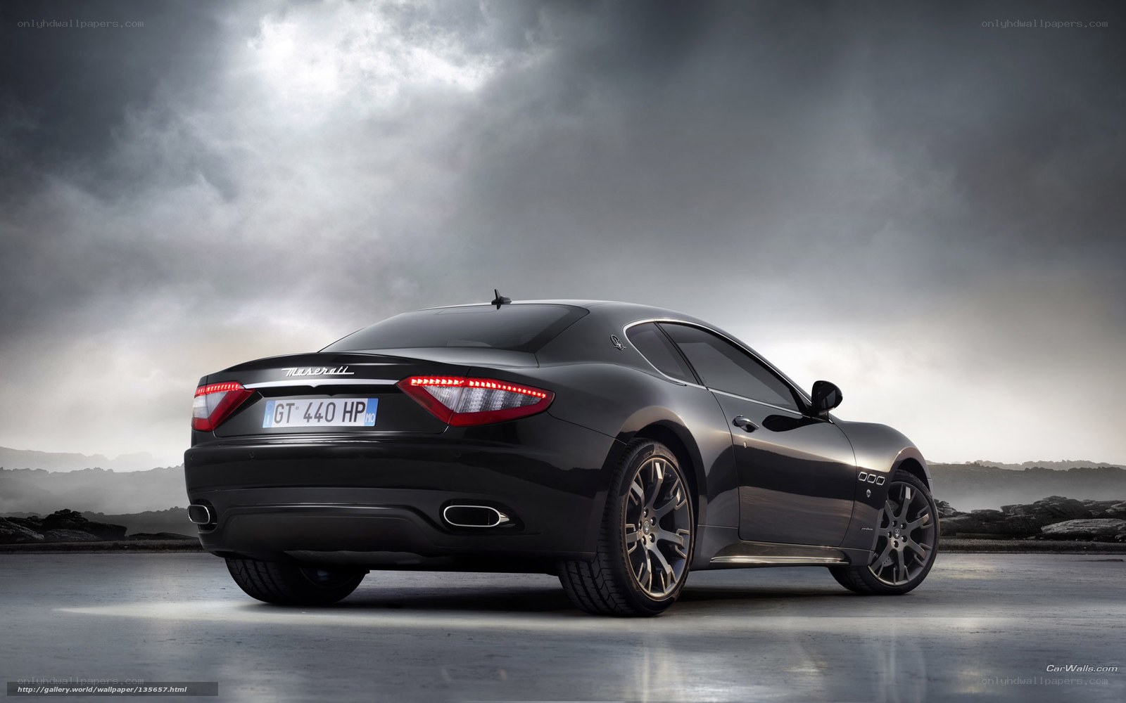 Black Maserati GT in dramatic lighting