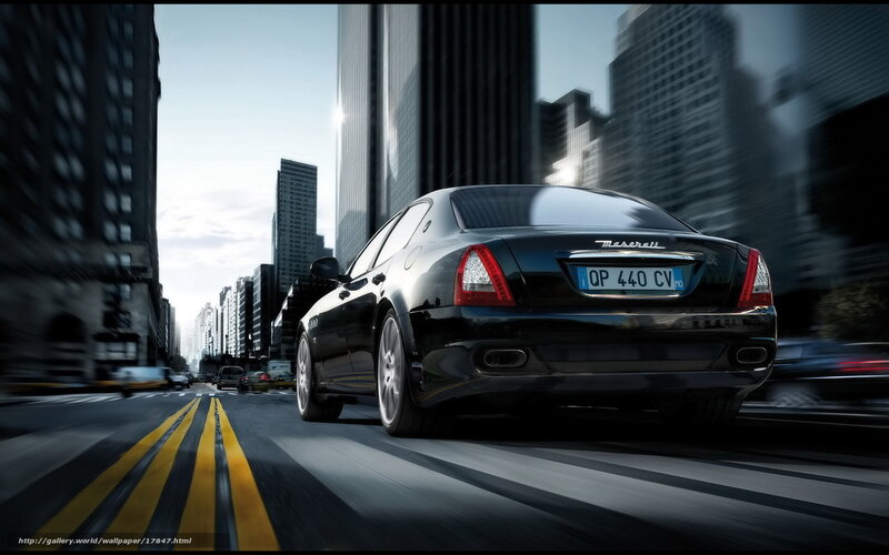 Black Maserati in city traffic