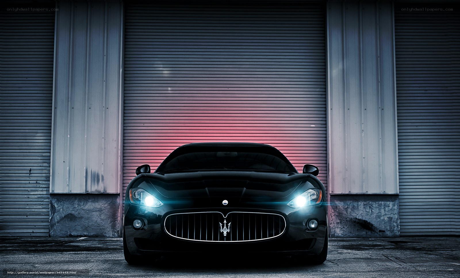 Black Maserati in garage
