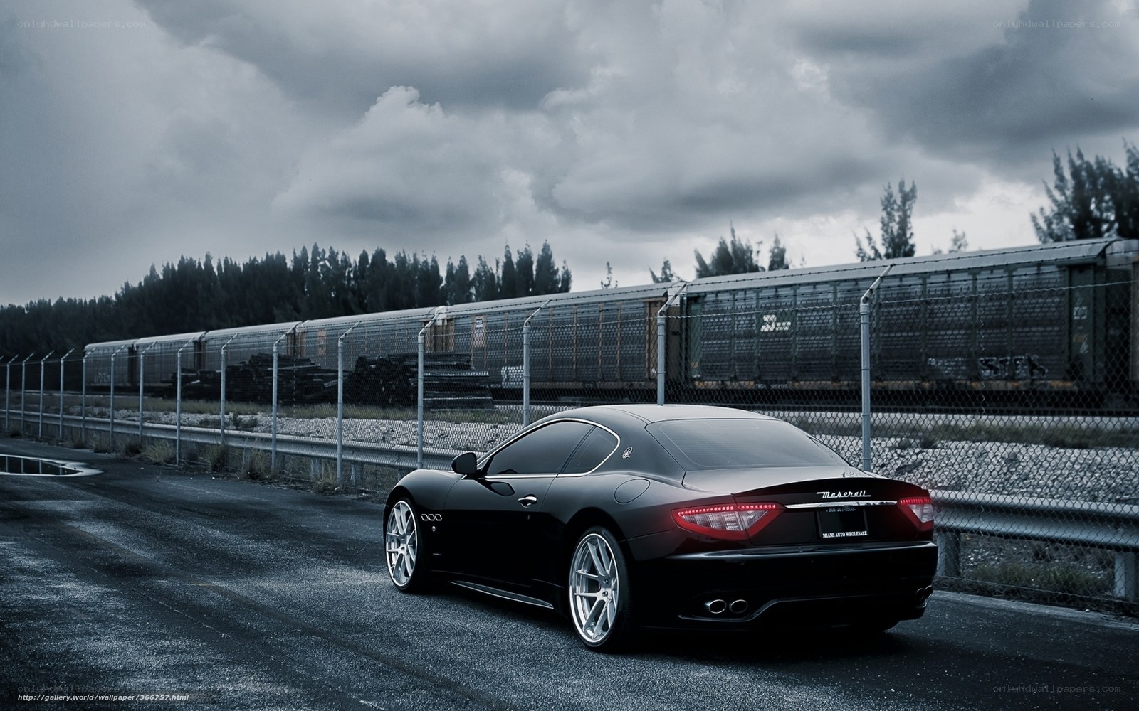 Black Maserati on a cloudy day
