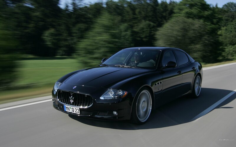 Black Maserati on a country road