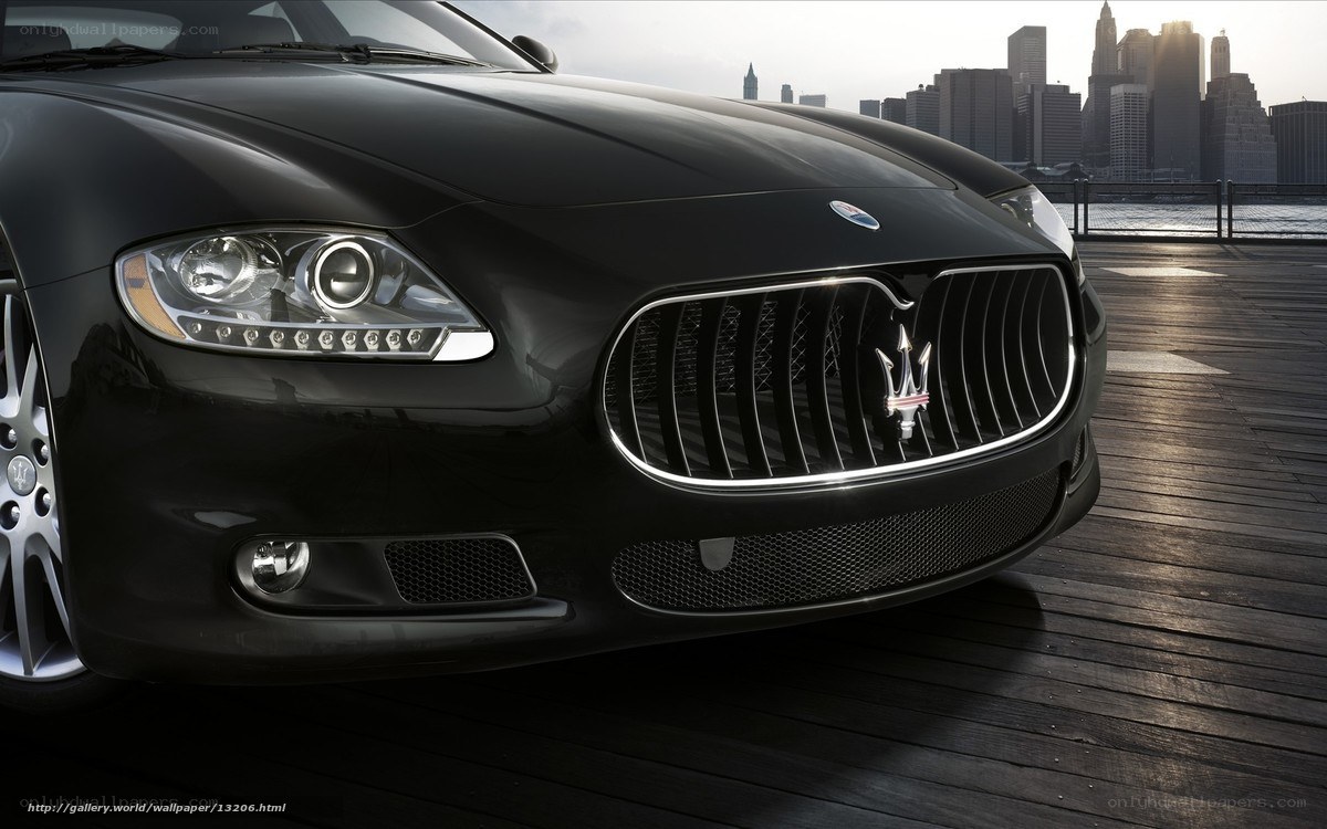 Black Maserati on a dock