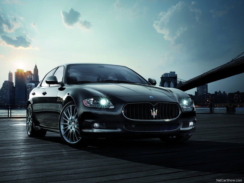 Black Maserati on a pier