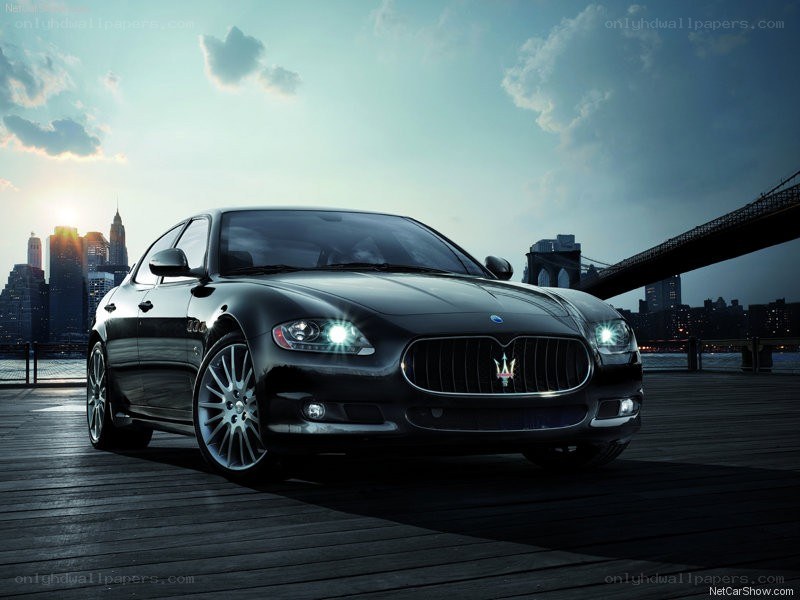 Black Maserati on a pier