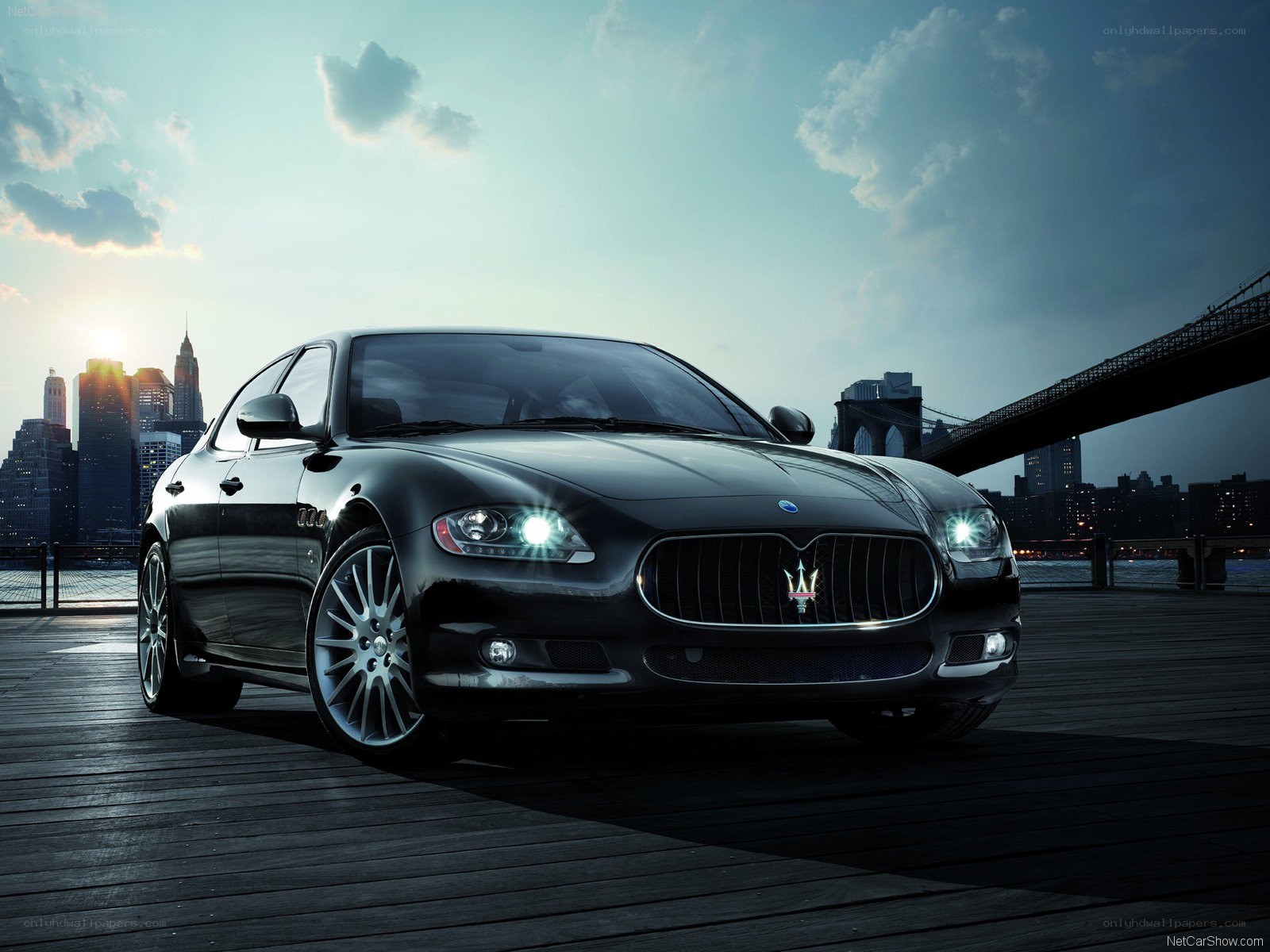 Black Maserati on a pier
