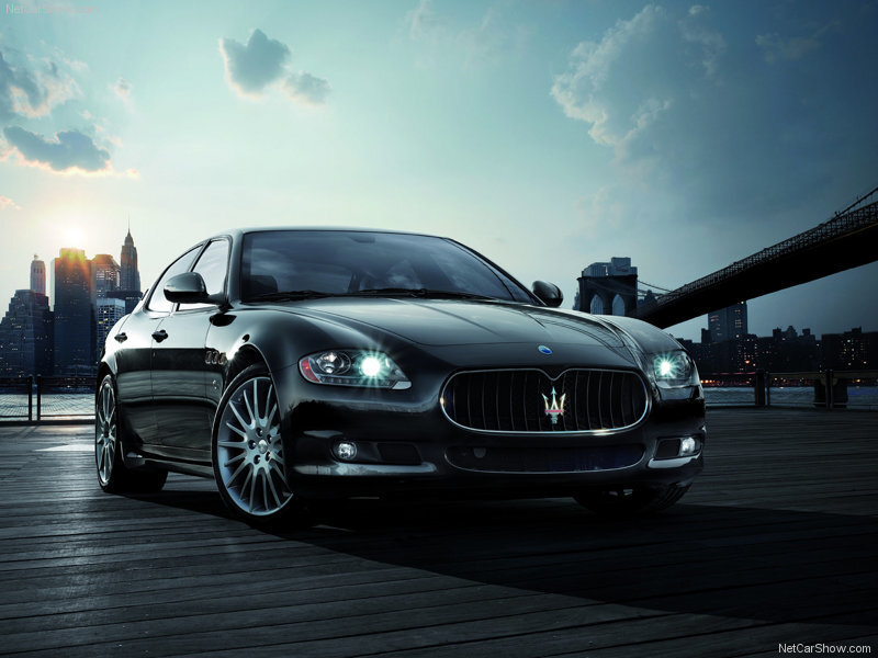 Black Maserati on a pier