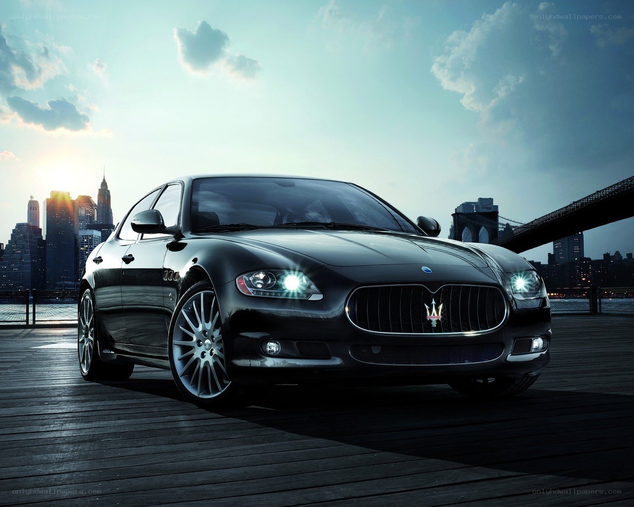 Black Maserati on a pier