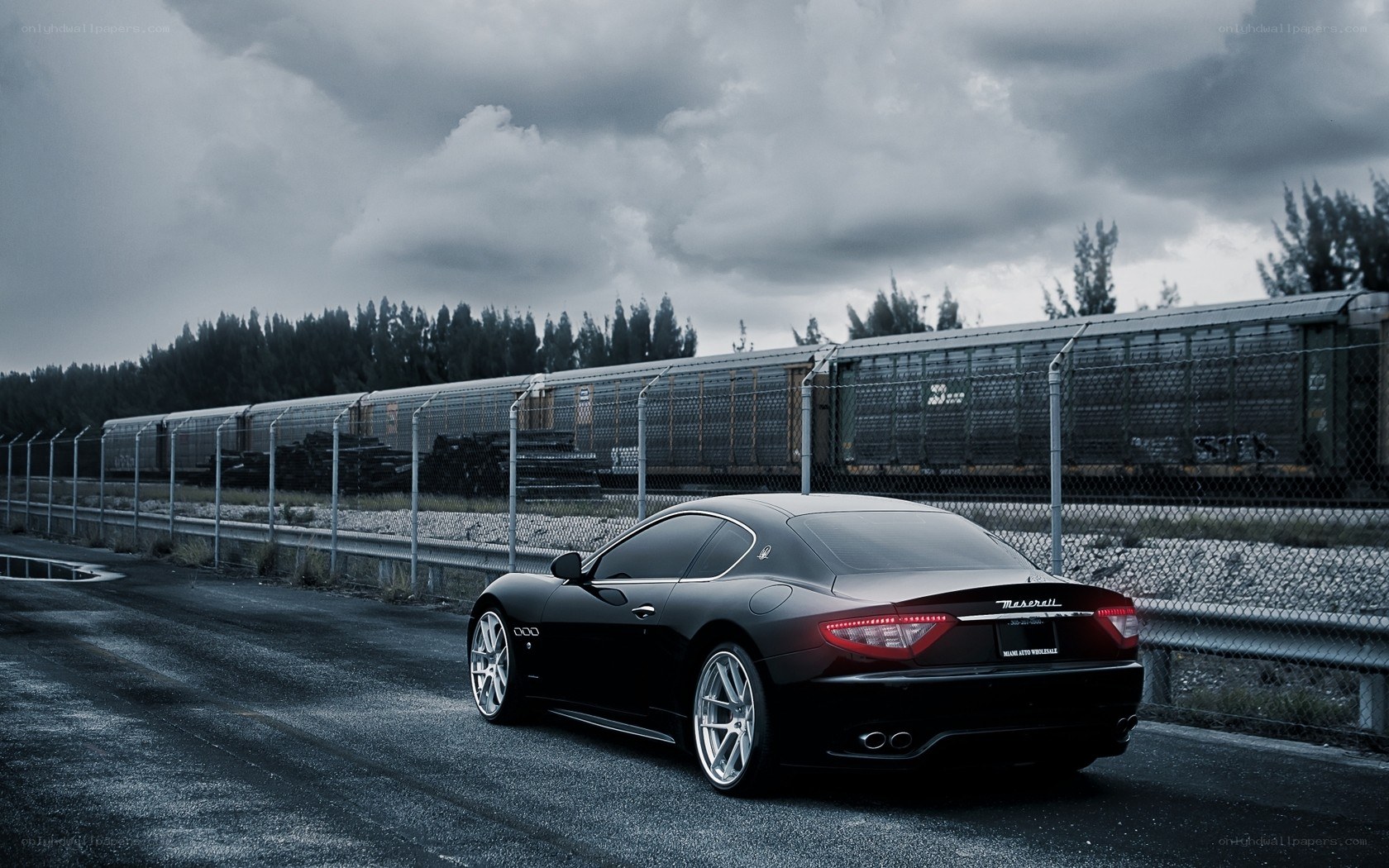 Black Maserati on a road