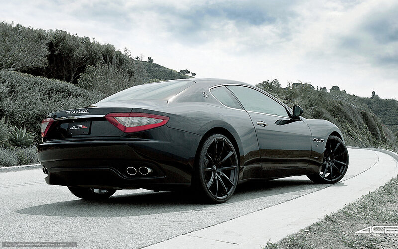 Black Maserati on a winding road