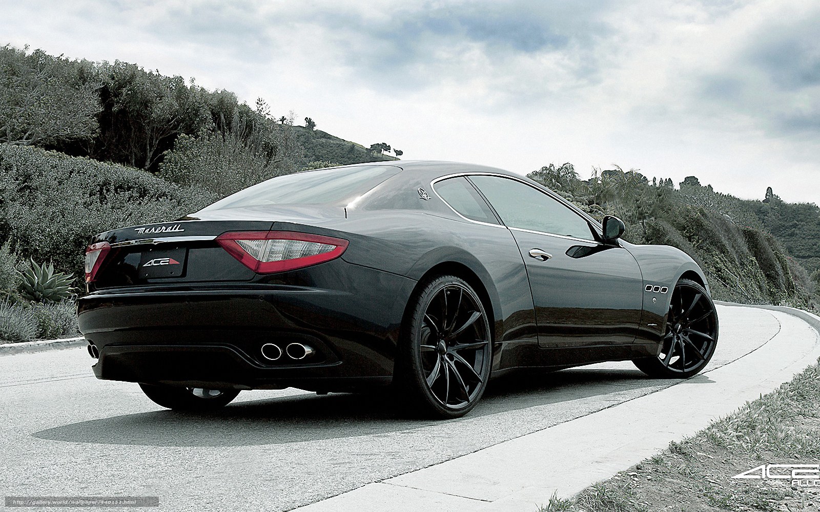 Black Maserati on a winding road