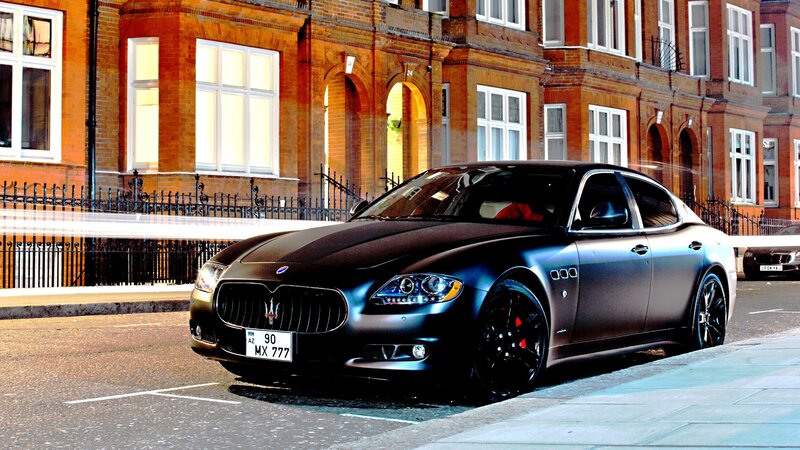 Black Maserati on city street