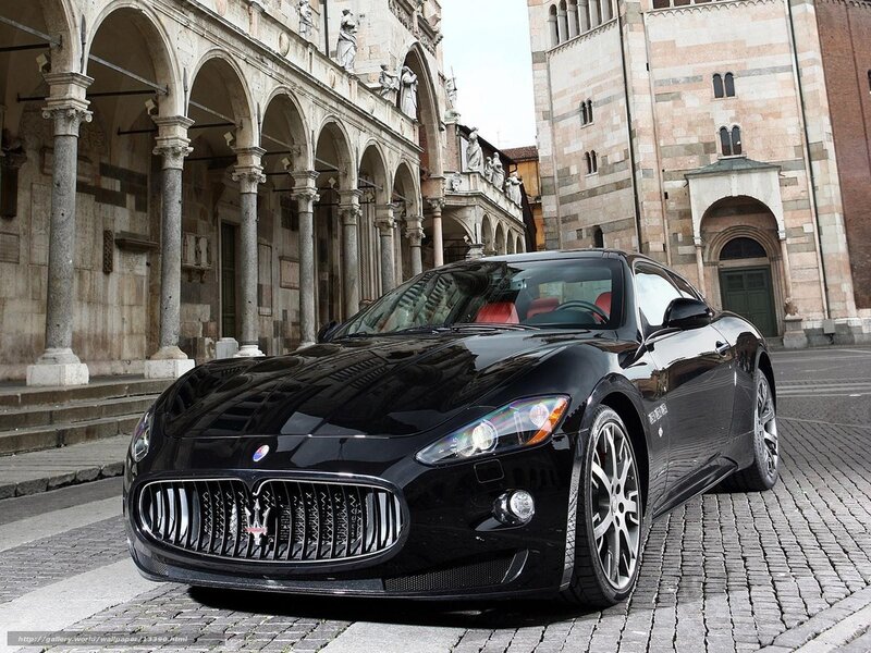 Black Maserati on cobblestones