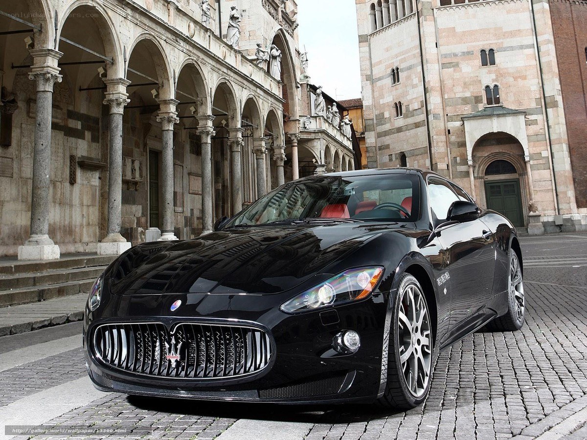Black Maserati on cobblestones