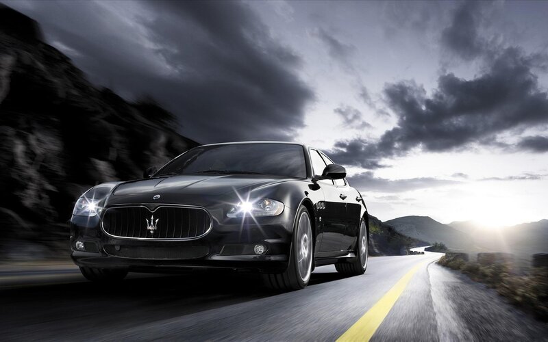 Black Maserati on mountain road